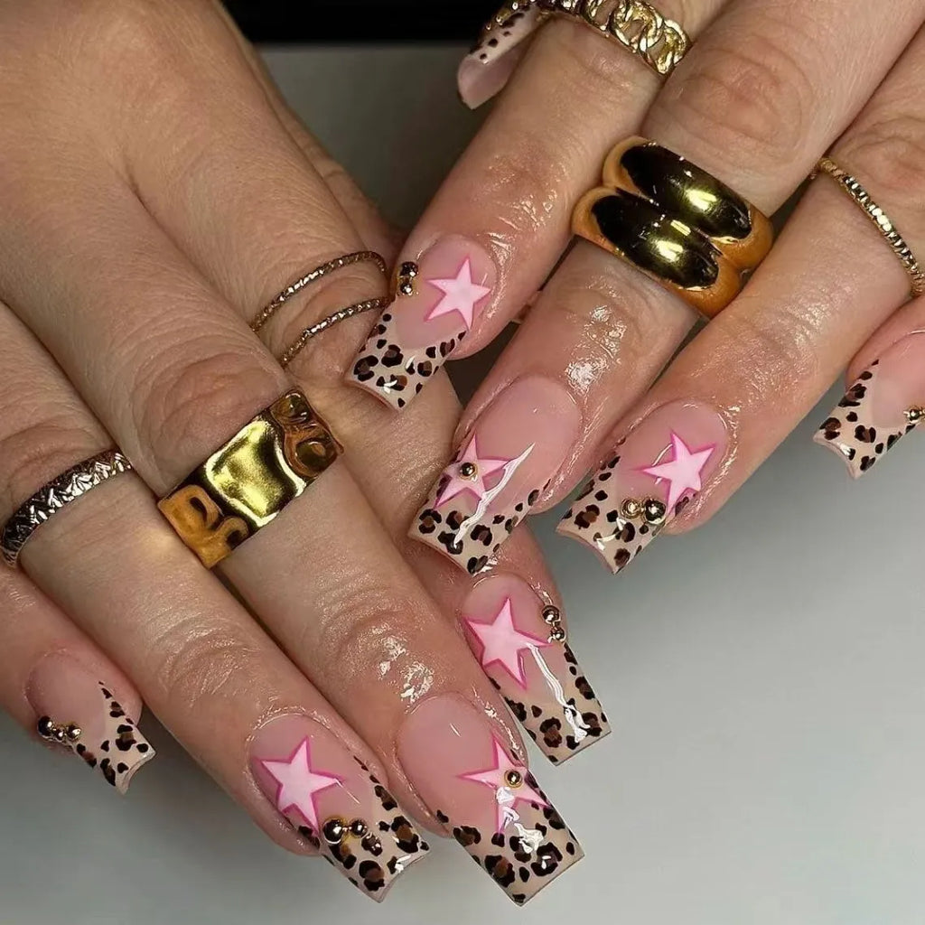 French style leopard print nail art strips with pearl and five-pointed star decorations for manicures.