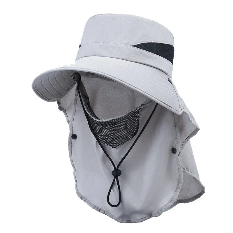 Men's grey fisherman hat with wide brim, shown from the side on a wooden post outdoors.