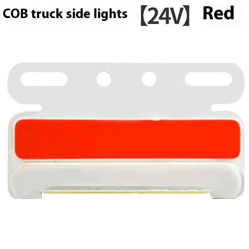 Aluminium alloy COB LED truck side light projecting bright white light onto ground next to tyre.