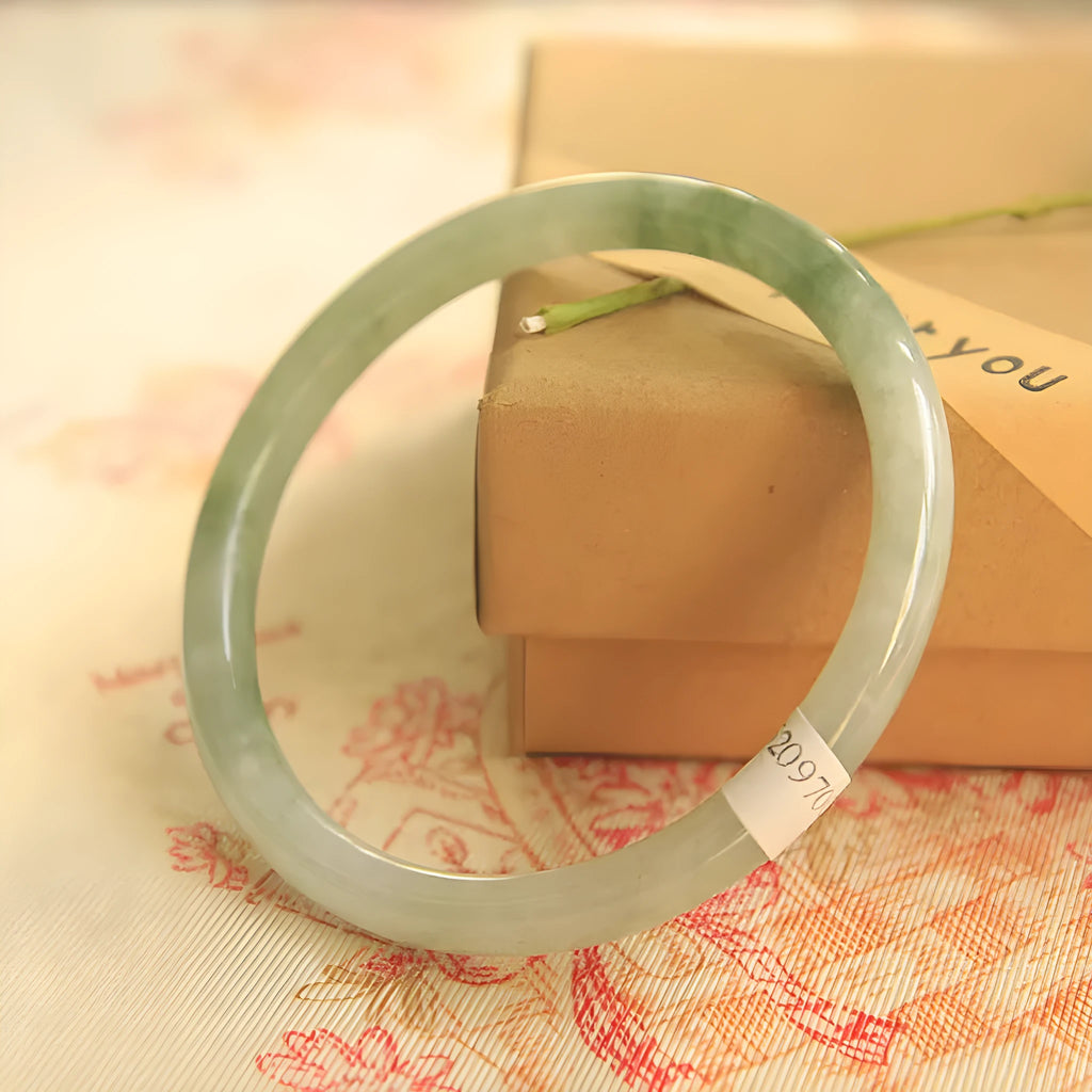 Green jade geometric bracelet with waxy finish showing 10mm width and Chinese style design