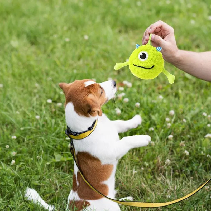 Green interactive dog toy ball with sound activation for teething and chewing
