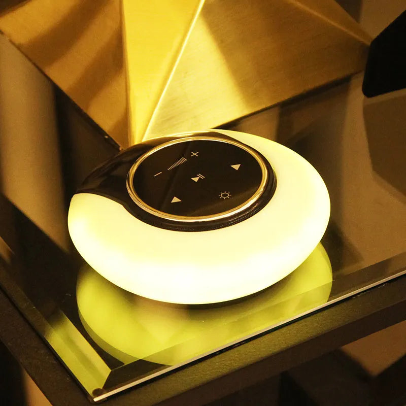 Blue Bluetooth desk lamp speaker with touch controls showing white, yellow and blue light options
