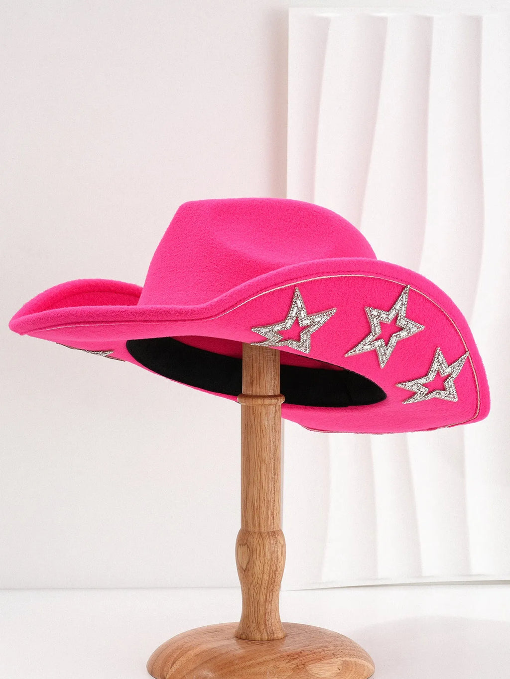 Beige woven polyester western top hat with a conical crown and a hexagonal star decoration on the front.