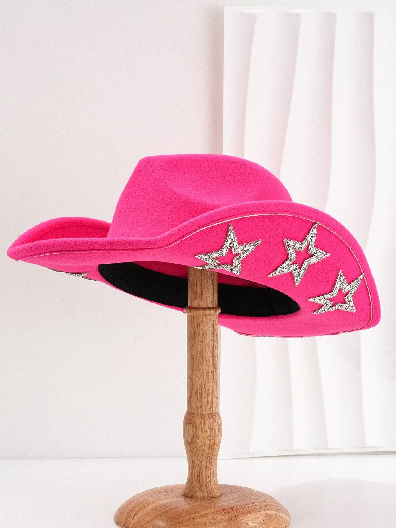 Beige woven polyester western top hat with a conical crown and a hexagonal star decoration on the front.