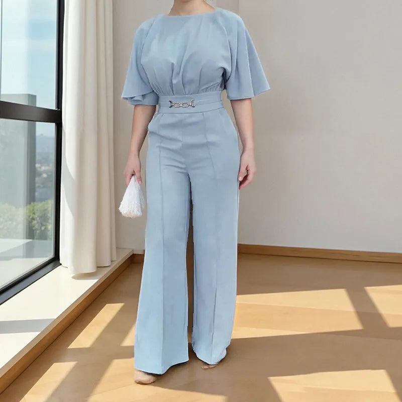 Blue men's casual suit with long sleeves and trousers on a hanger