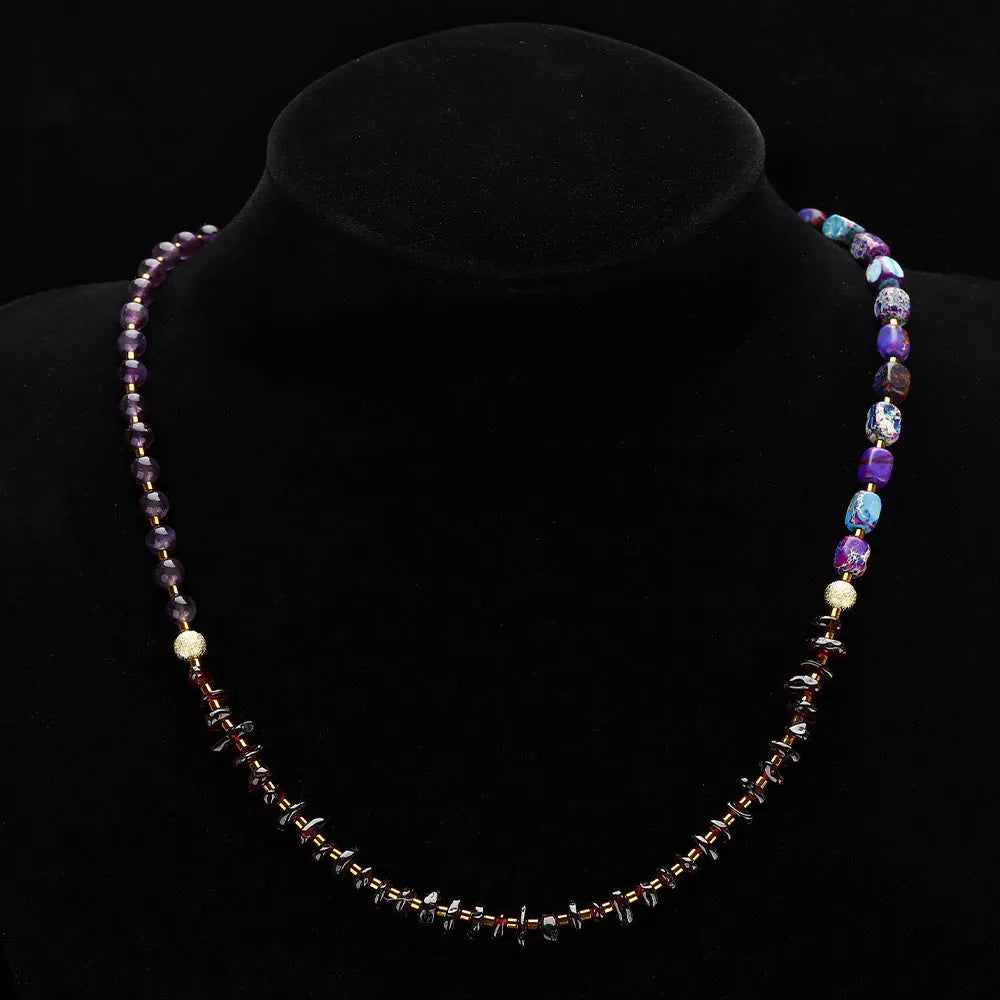 Purple amethyst and garnet stone bracelet with geometric beads and texture details