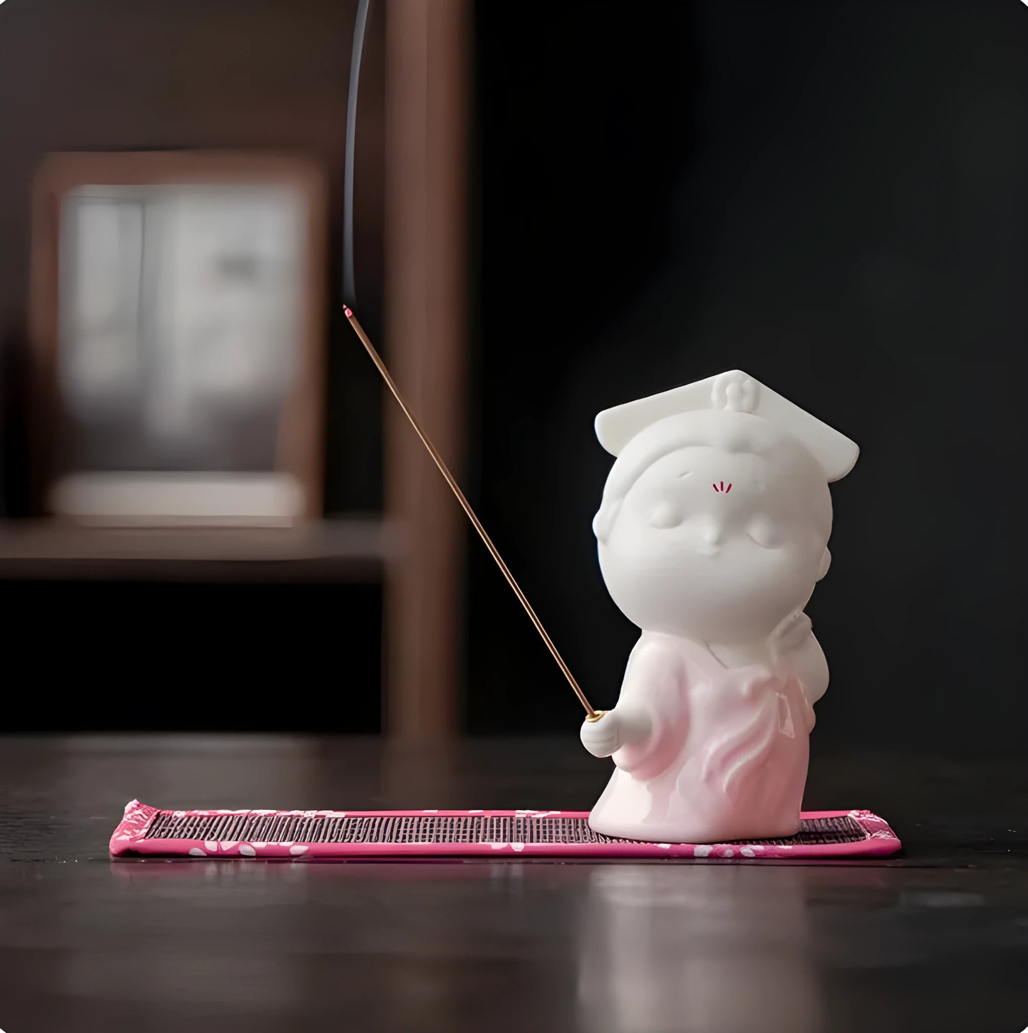 Ceramic cute court attendant incense burner decoration in fresh style on a plain background.