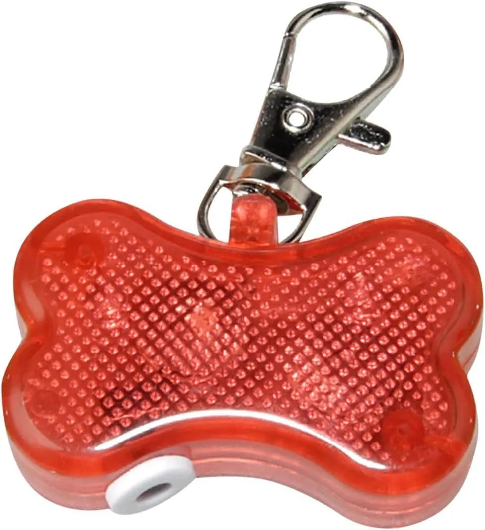 Blue LED luminous bone-shaped pendant for pet collars showing scale next to LR44 batteries.