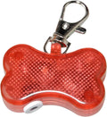 Blue LED luminous bone-shaped pendant for pet collars showing scale next to LR44 batteries.