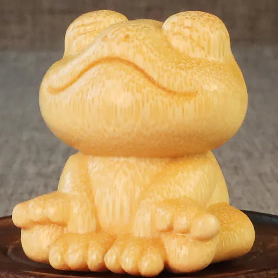Solid bamboo smiling frog carving ornament measuring 5cm high with cartoon cute style