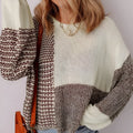 Dark khaki colour-block loose sweater with a back tie and drop shoulders on a hanger.