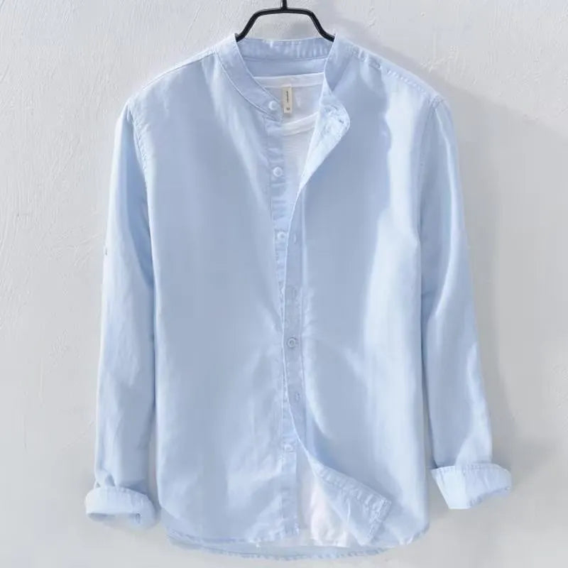 A man's loose-fitting, long-sleeve casual shirt in a cotton linen blend, shown in a solid colour.