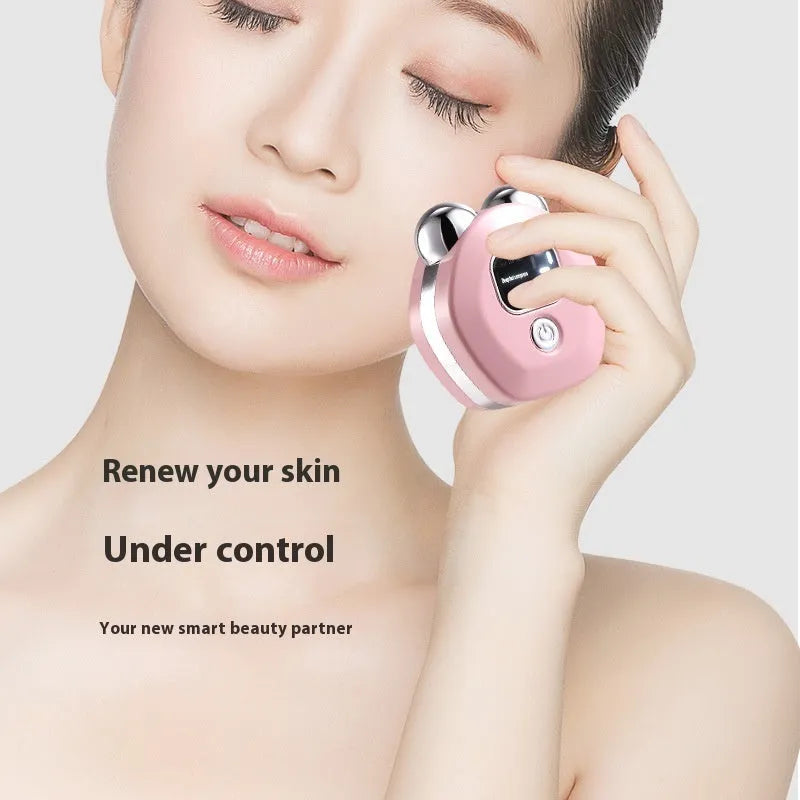 White portable facial massage instrument with double-roller head and USB cable on a blue background.
