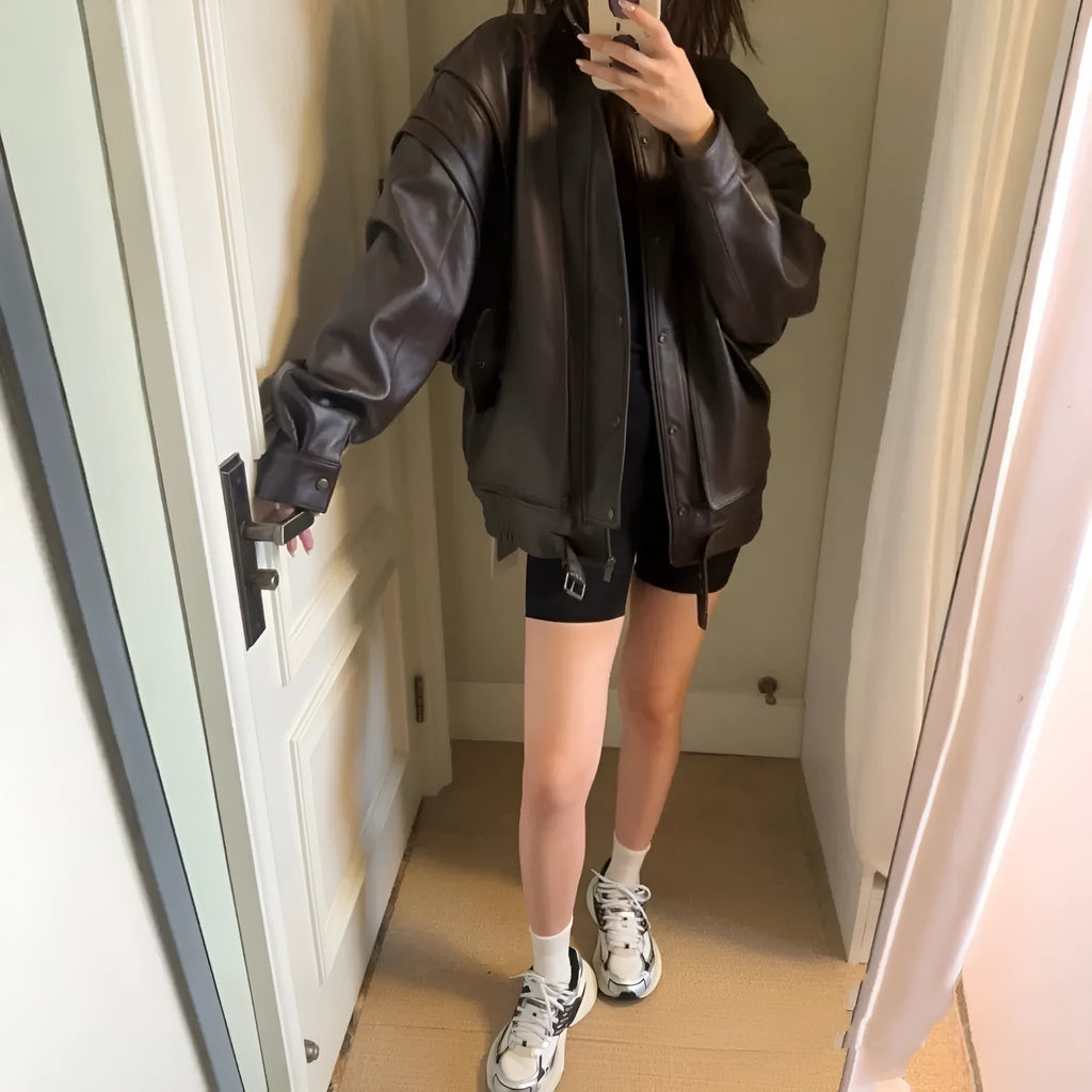 Women's loose fit brown faux leather jacket with front zipper and regular sleeves