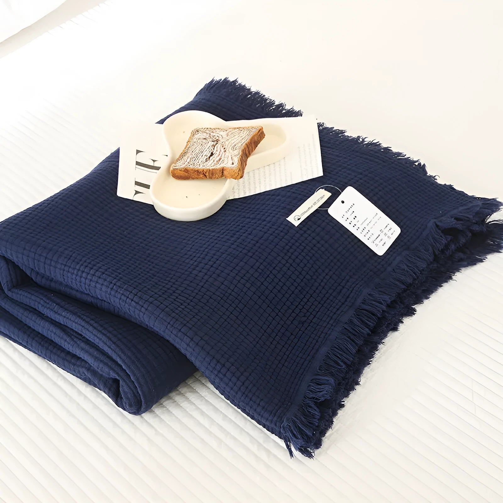 Four-layer cotton gauze blanket with tassel trim in navy blue colour