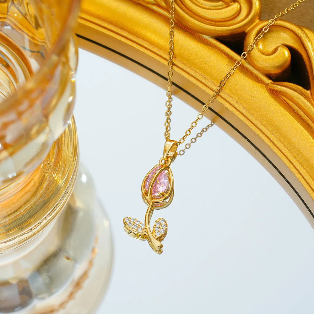 Gold tulip flower pendant necklace on an adjustable O-ring chain, showing electroplated finish.