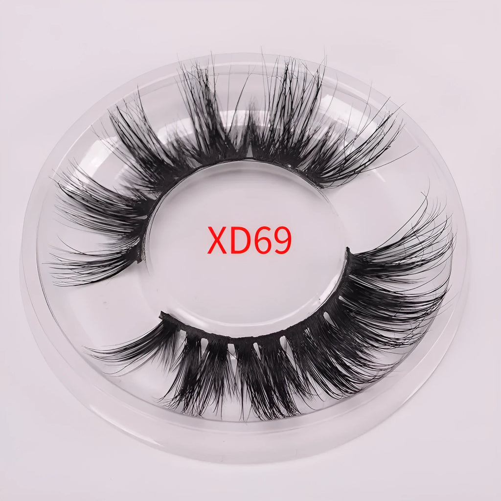 5D mink false eyelashes set with hair cap and double-headed brush on a white background.