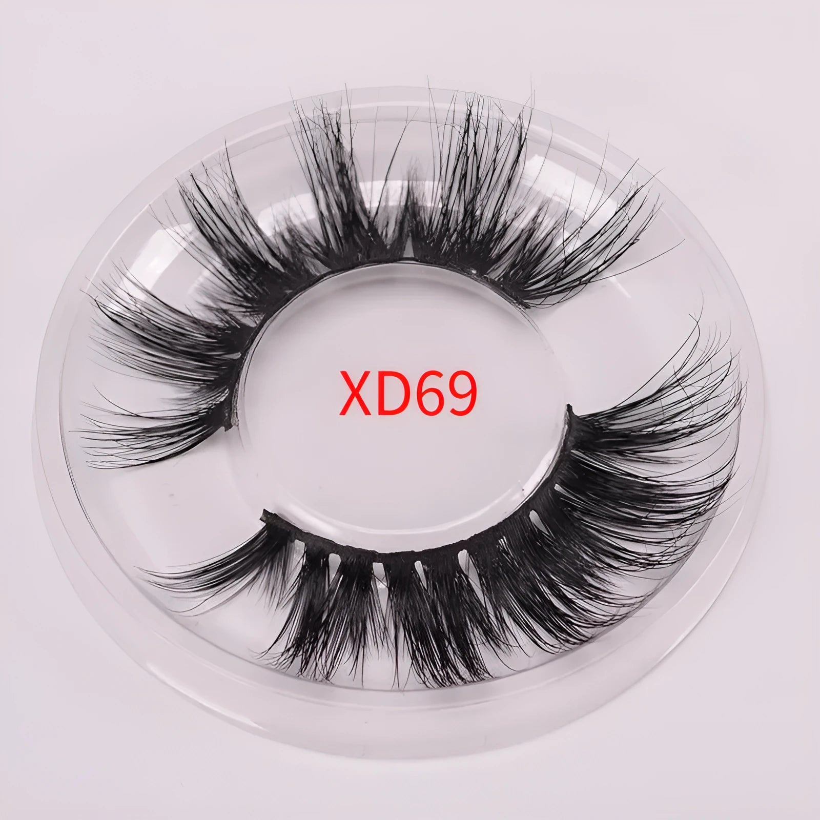 5D mink false eyelashes set with hair cap and double-headed brush on a white background.