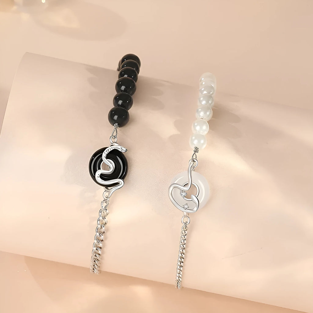 A new Chinese style 925 sterling silver bracelet with an obsidian pearl, snake zodiac charm, and a safe buckle clasp.