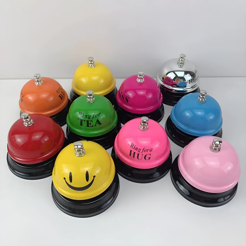 Iron game bell in assorted colours including red, blue, green, pink, and yellow for service or classroom use.