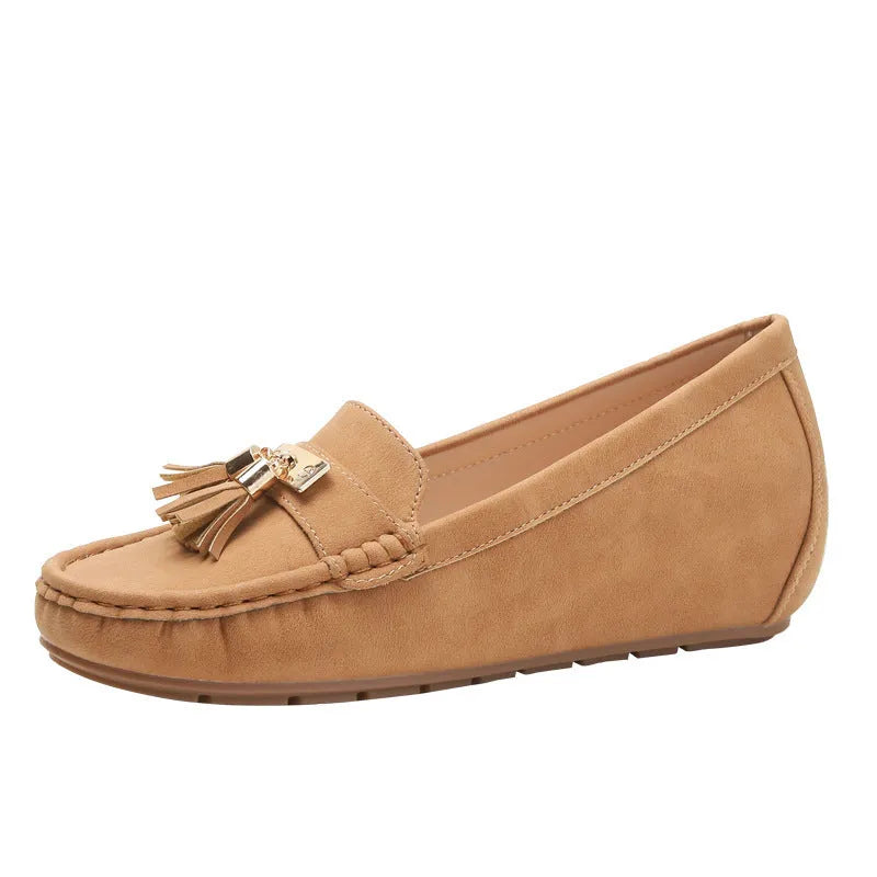 Nude coloured heel lift insoles for women's shoes, showing artificial PU leather upper and round toe shape.