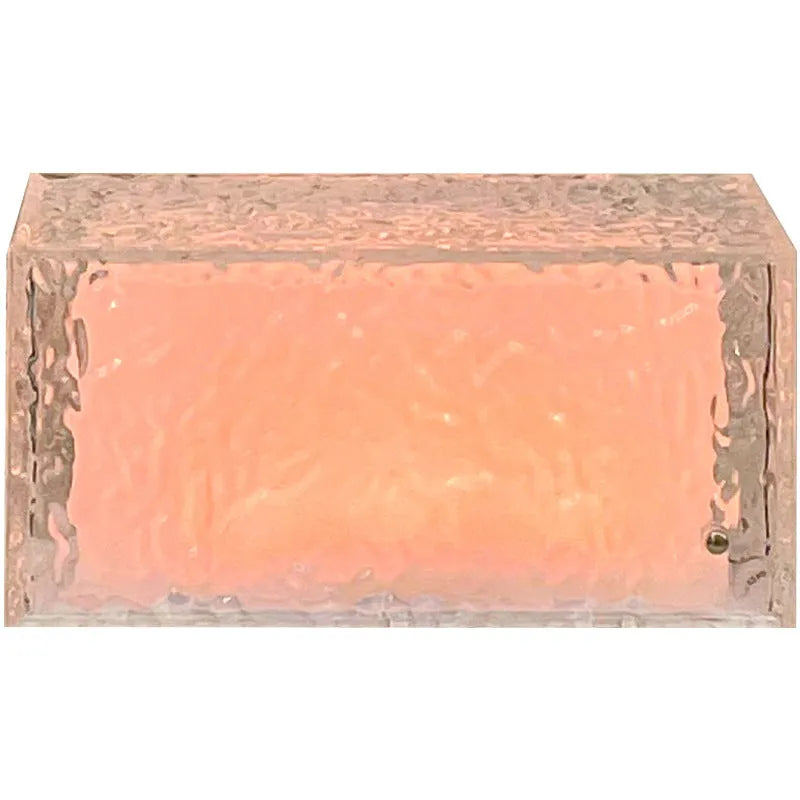 Clear acrylic geometric ice cube shaped night lamp glowing with soft colour changing light.