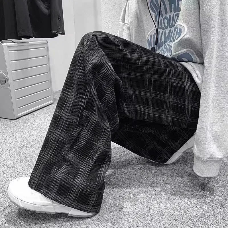 Men's black and green plaid loose fit straight leg trousers with mid waist design