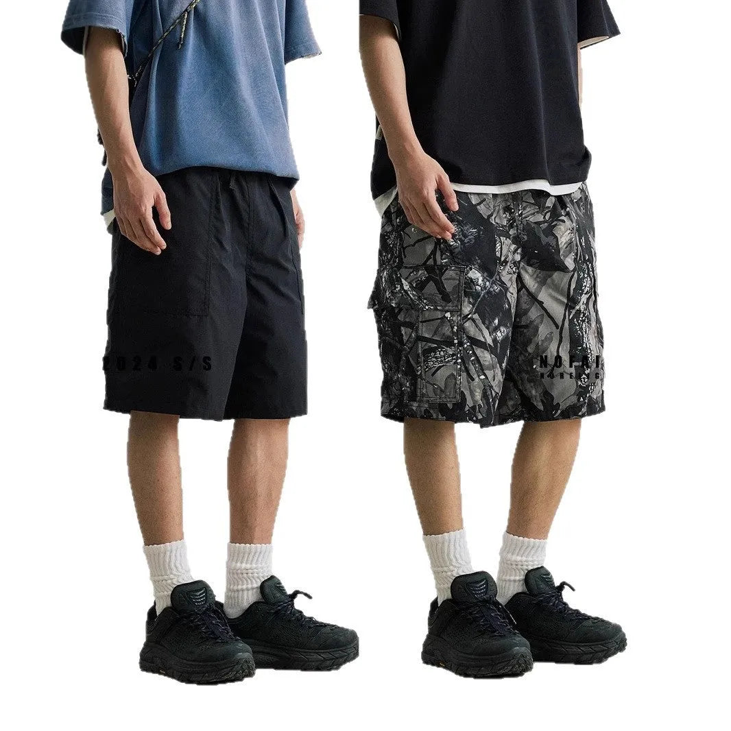 Loose casual straight-leg denim shorts in black or army green with mid-waist and zip fly