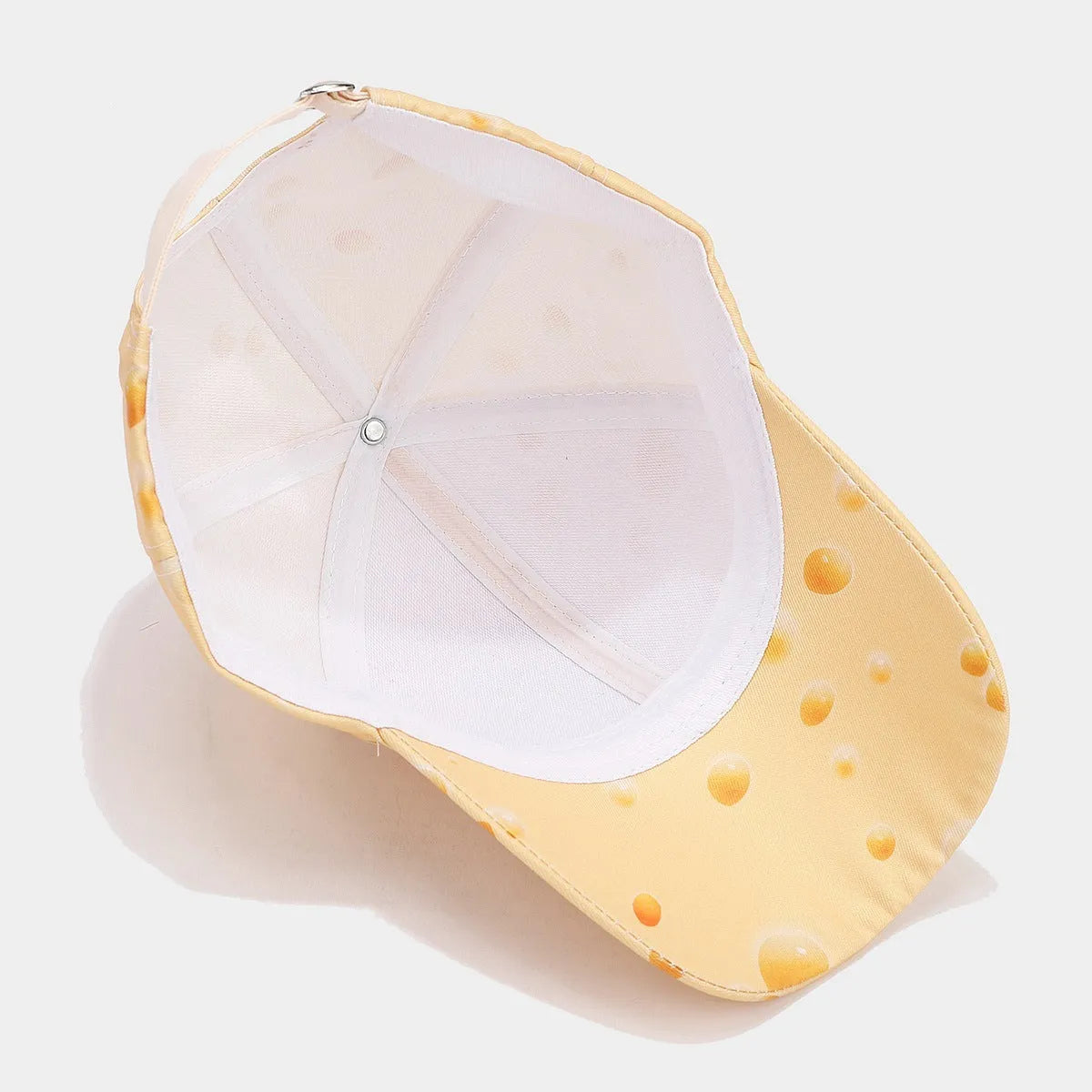 Printed cheese pattern adjustable peaked cap with dome crown and polyester construction