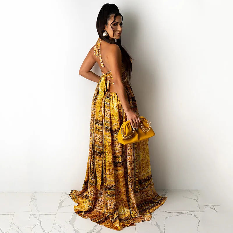 Sleeveless printed halter split dress in yellow brown with mid waist and long skirt, sizes S to 3XL.