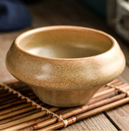 Tall porcelain ceramic Japanese soup bowl with underglaze vintage pattern on wooden table.