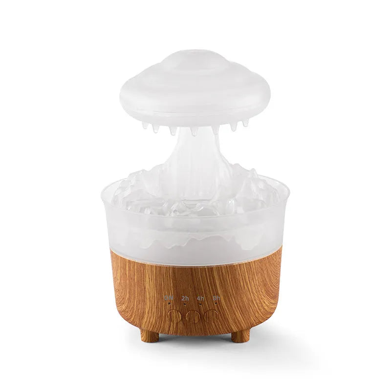 Wood grain rain cloud shaped humidifier and essential oil diffuser with night light on a table.