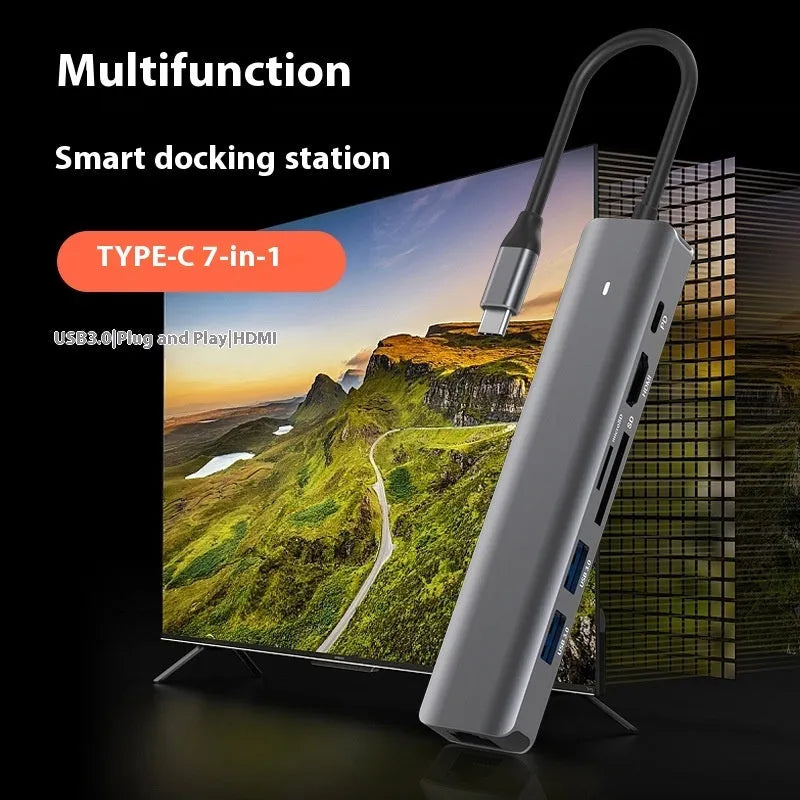 Silver 7-in-1 USB-C laptop hub showing HDMI, USB-C PD, USB 3.0, and SD card ports