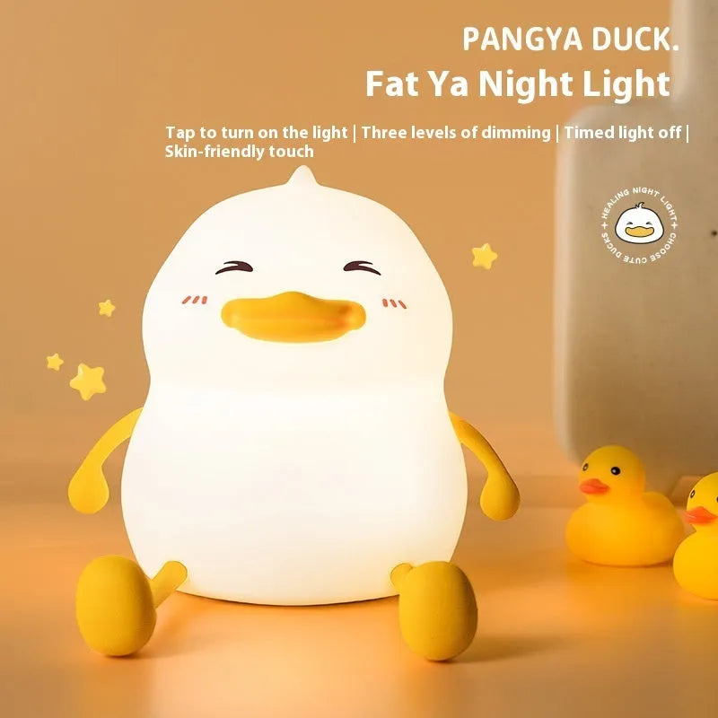 Chubby Night Light portable LED desk lamp on a wooden table showing soft glow and compact design