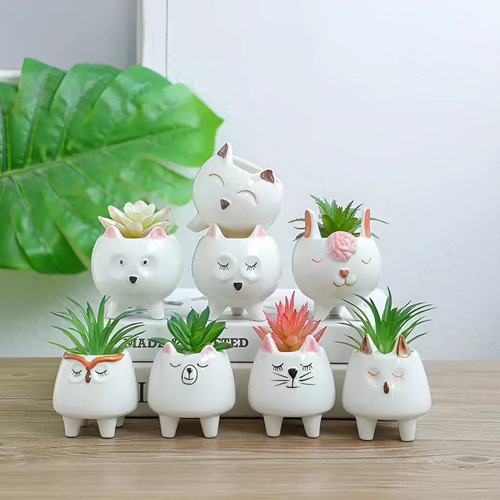 Hand-painted ceramic succulent flowerpot with cartoon animal and flower design in pastoral style.