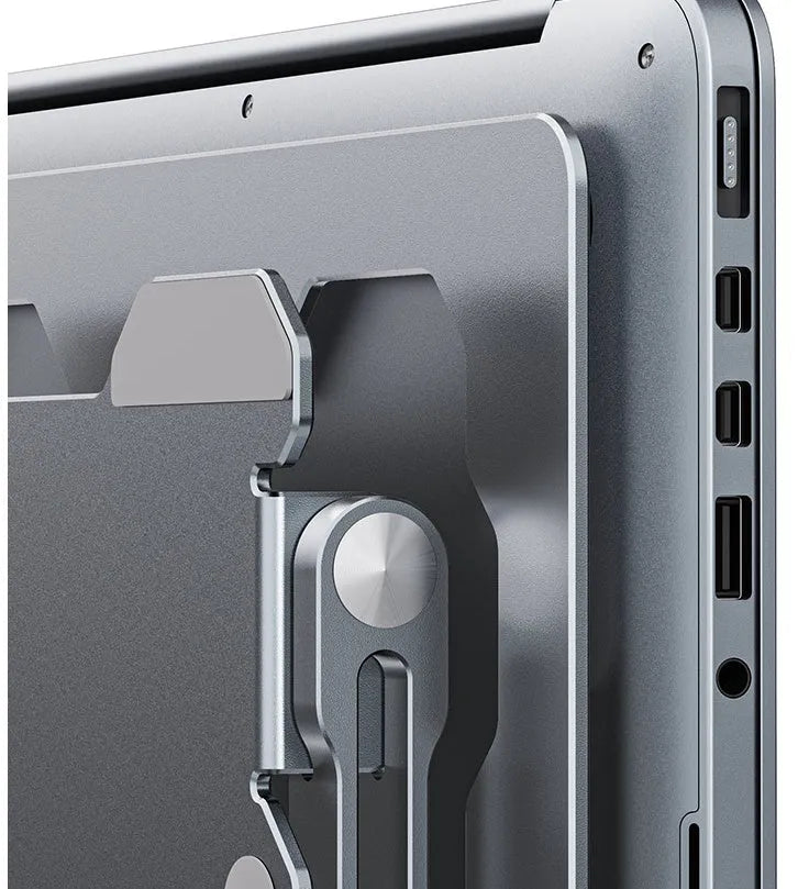 Grey adjustable aluminium laptop stand holding a silver laptop, shown in a folded and unfolded position.