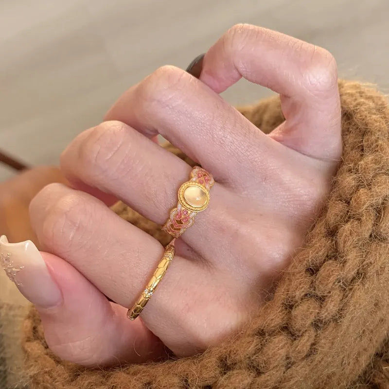 Geometric open ring for women in gold-plated copper with a pink crystal enamel detail.