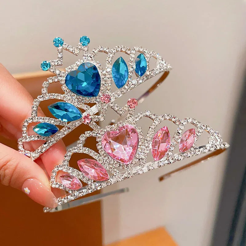 Girl's shiny metal headband with a crystal crown design in pink, light blue, and light purple colours.