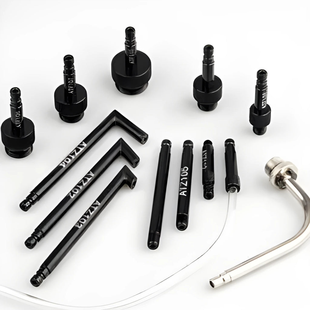 13-piece transmission oil refuelling kit showing injector tool and assorted connectors on a workbench
