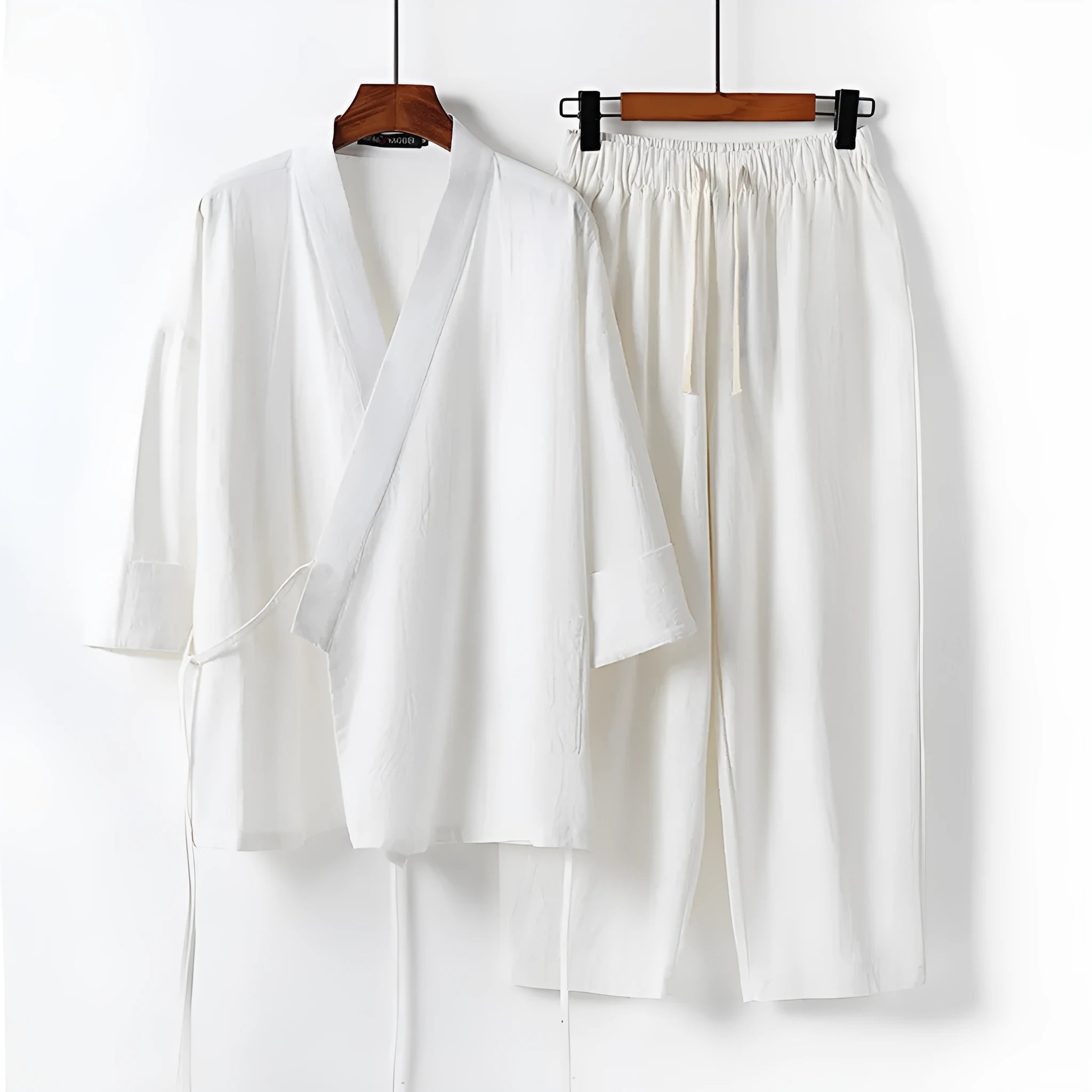 Cardigan-style Hanfu two-piece suit in cotton and linen, shown in apricot colour with shirt-style jacket and trousers.