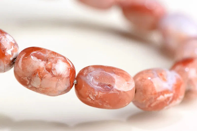 Natural cherry agate bracelet with 10x14mm barrel beads in geometric design