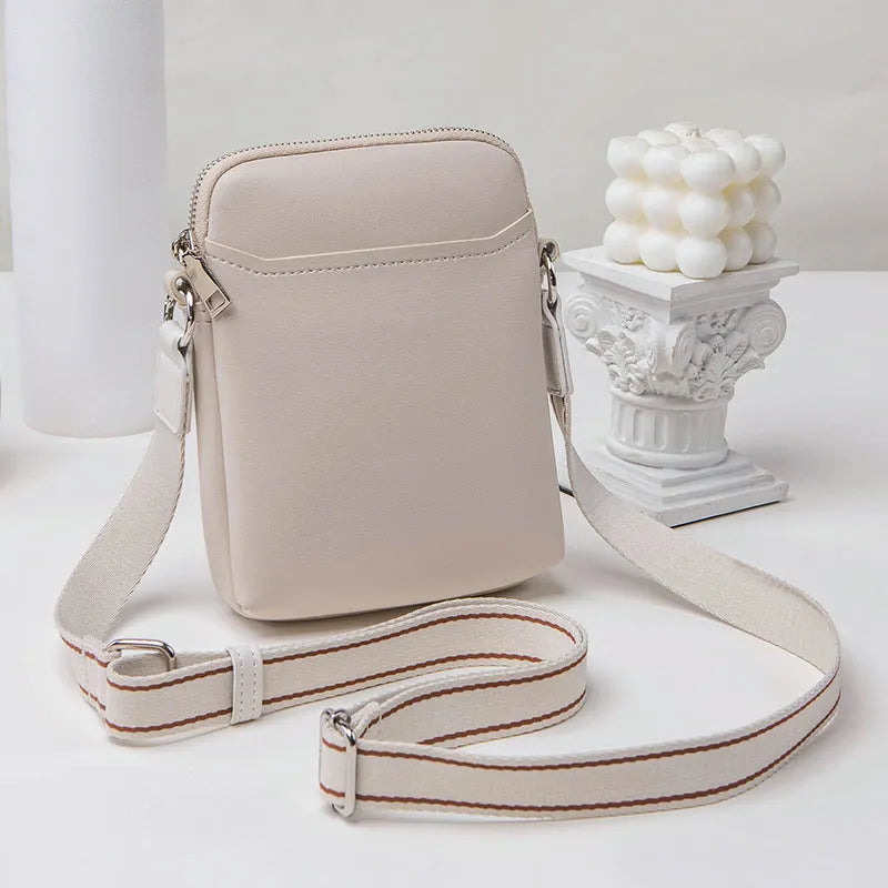 Solid colour PU leather crossbody phone bag in beige, shown with adjustable strap.