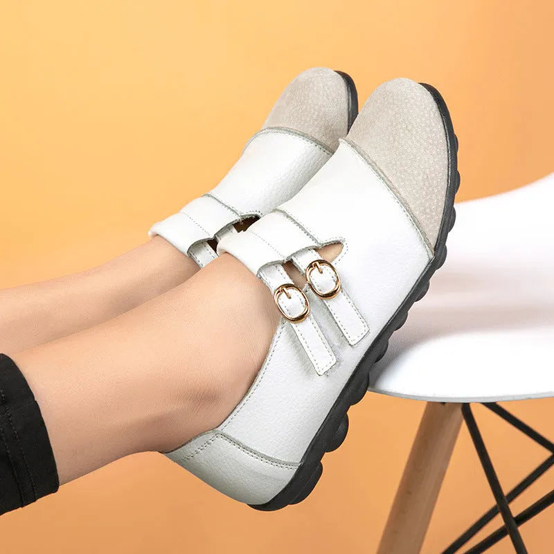 A pair of casual low-top flat shoes with Velcro fastening and a round toe, shown in various colours.