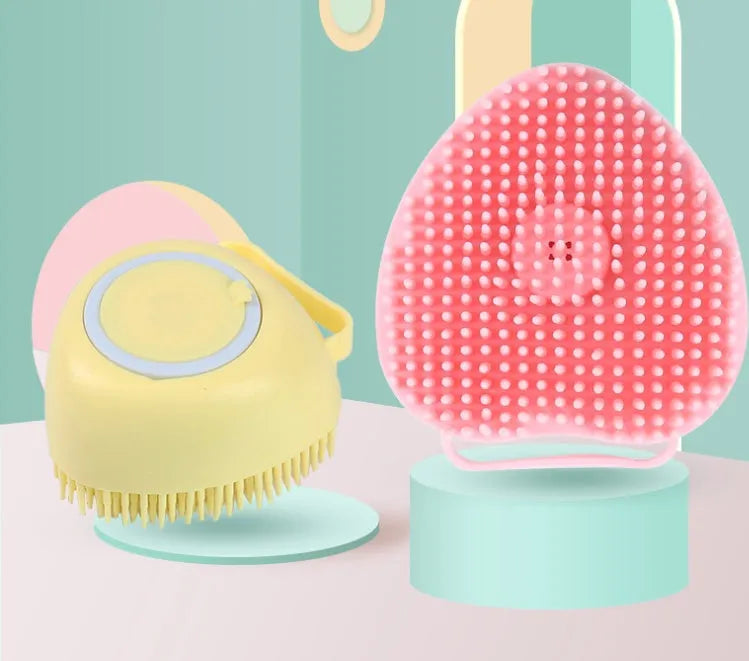 Silicone dog bath brush with finger loops in blue, pink, and yellow colour options