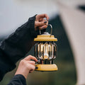 Rechargeable camping lantern in Sundial Yellow with iron and ABS construction, Type-C charging, 5000mAh battery, and 130 lumens adjustable brightness