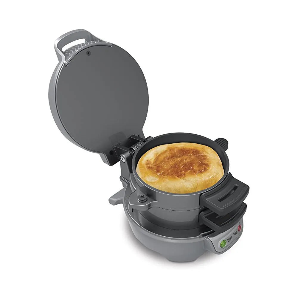 Bright red breakfast sandwich maker with egg cooking ring and waffle plates on kitchen counter