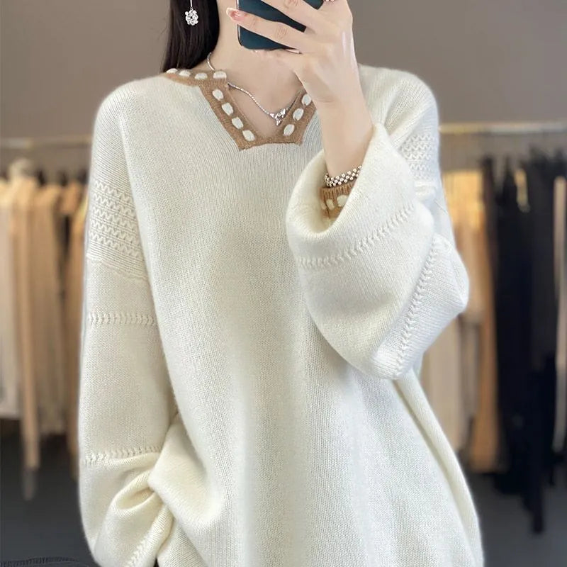 Women's camel-coloured V-neck long sleeve viscose pullover sweater on a hanger.