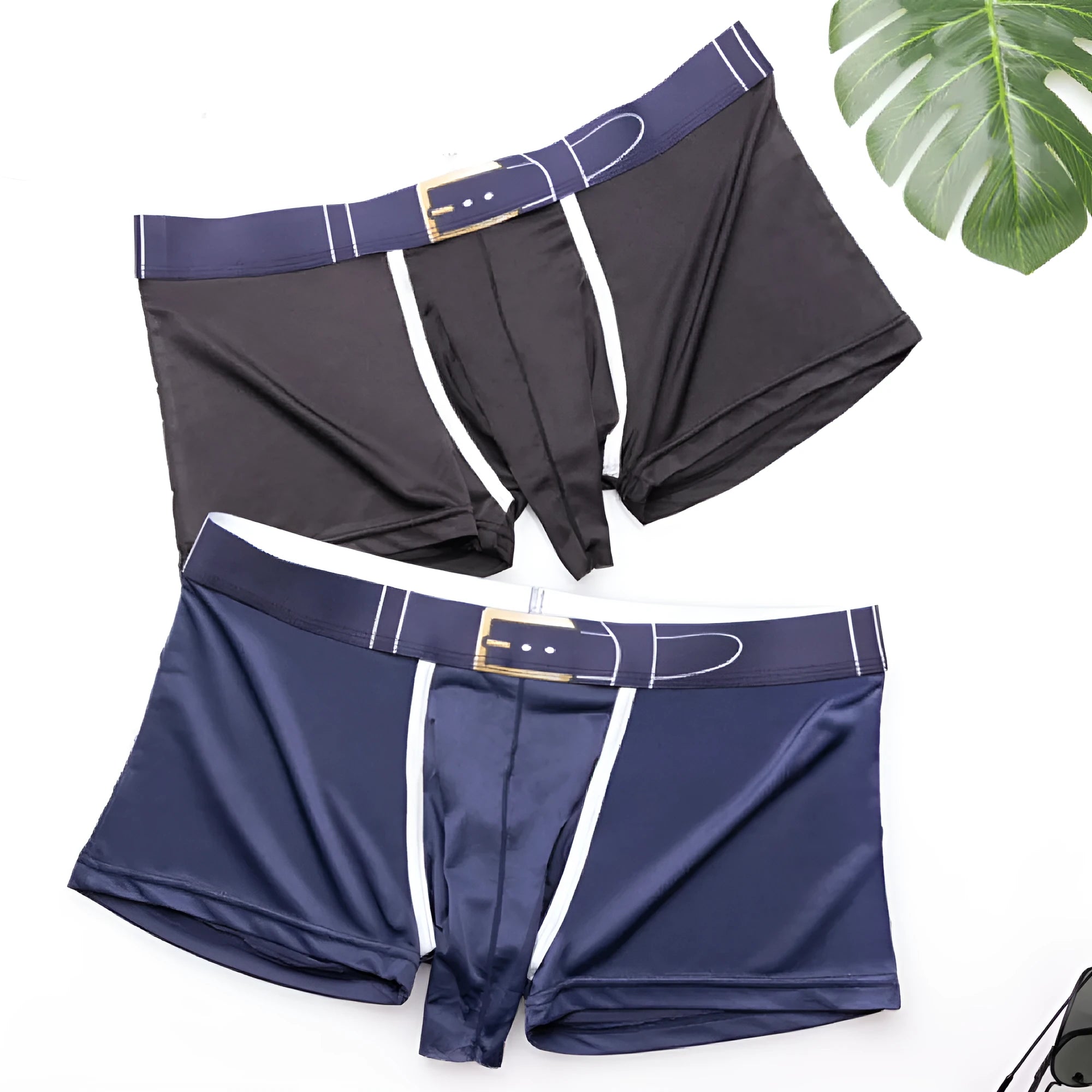 A pair of solid grey men's ice silk boxers laid flat, showing the mid-waist design.