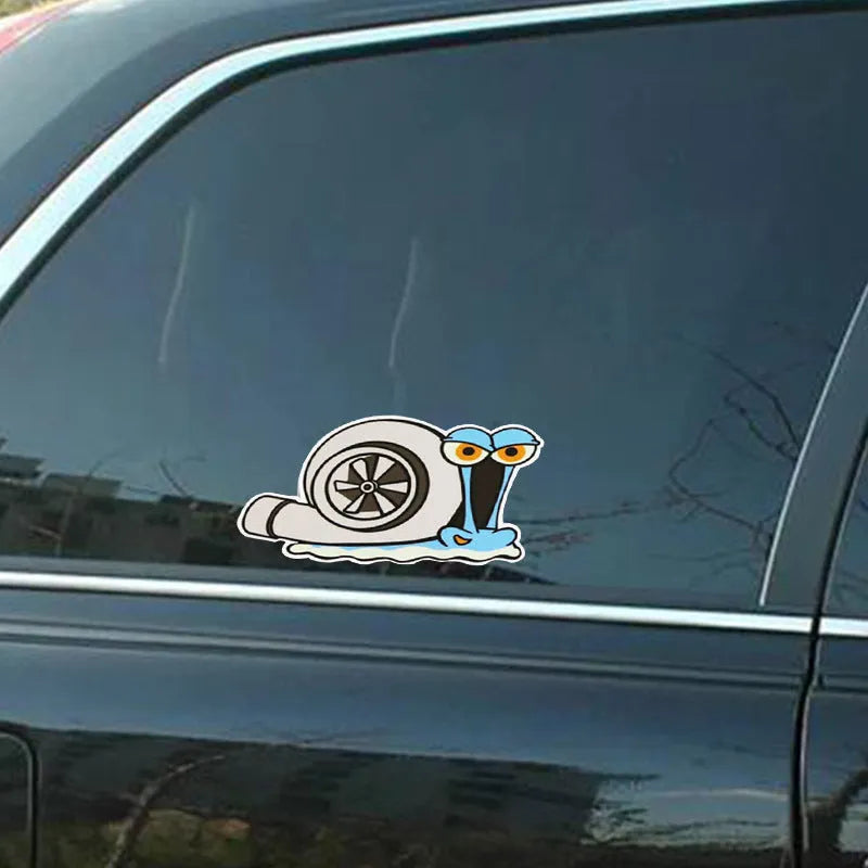 White reflective cartoon snail car sticker measuring 12 by 8 centimetres.