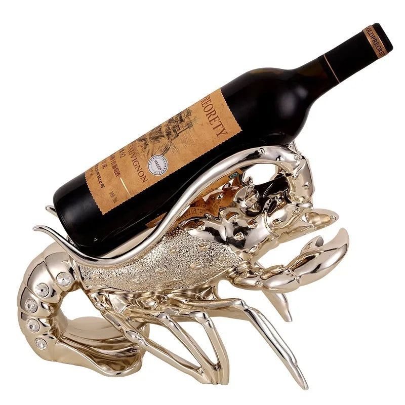 Lobster-shaped decorative wine rack ornament in rose gold or silver finish on a tabletop.